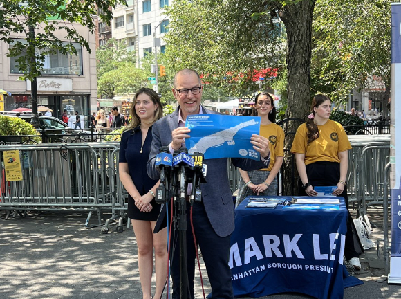 Teddy Siegel and Manhattan Borough President Mark Levine canvassing a map of NYC public bathrooms in July 2024.