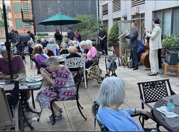 Rooftop terrace dining and live jazz at Carnegie East House.
