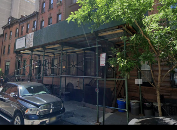 The residential building in Gramercy Park at 116 E. 17th St., has had sidewalks sheds surrounding the building for more than five years.