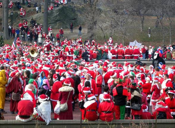 A horde of Santas schmoozing in the park during 2010’s festivities.