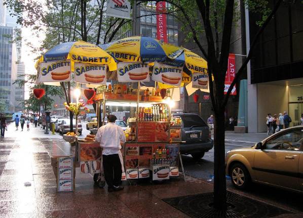 The city announced its plan to shift responsibility for enforcing regulations on street vendors like this one to the Department of Sanitation. <b>Photo: Flickr.</b>
