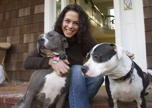 Rebecca Ascher-Walsh with Desi, Ascher-Walsh's second adopted pit bull, left, and Buddy. Photo: Ellen Watson