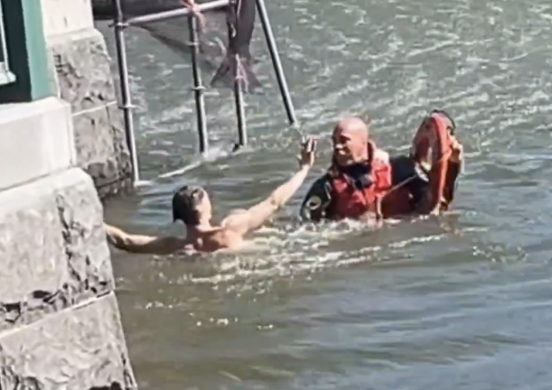 Jason Taylor resists arrest in Central Park’s Harlem Meer after an alleged petit larceny at a Lenox Avenue dry cleaner.