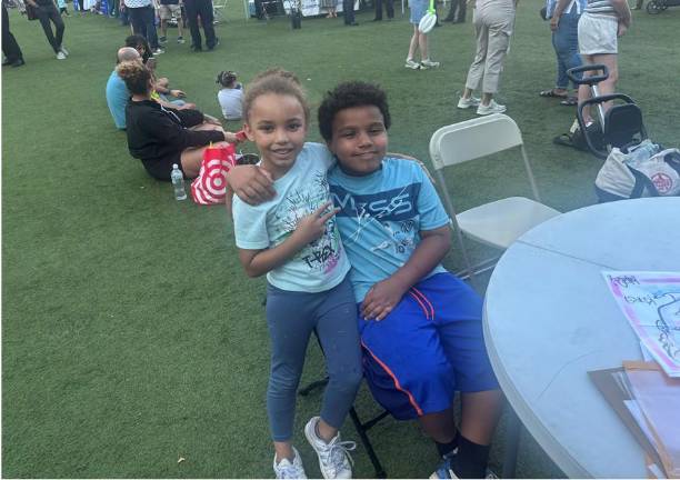 James, 9 and sister, Kiara, 6, at the table with a sketch artist on National Night Out Against Crime in the 13th Pct. held at Peter’s Playground on Second Ave. and East 20th Street.