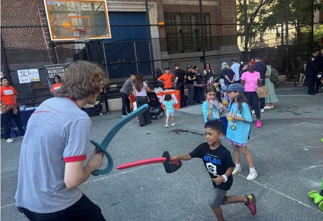 Xavier, who said his age was “five and three quarters” jabs at a staffer from the Sheridan Fencing Academy. He said he plays soccer every day but he rated his first jousting experience as “good.”