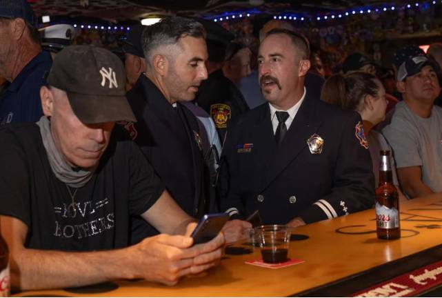 Members of service, their families and New Yorkers gathered at O’Hara’s Pub near Ground Zero on the 25th Anniversary of 9-11.