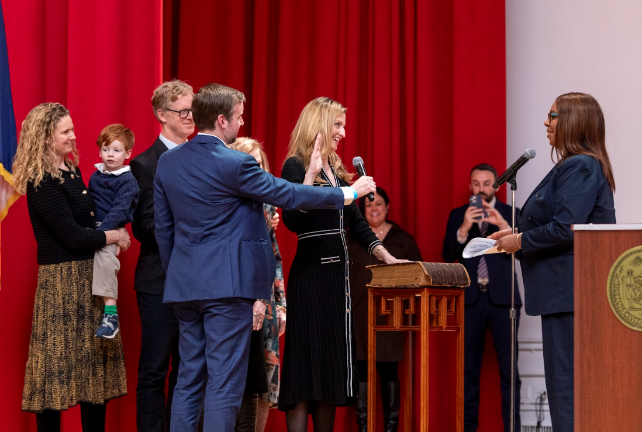 New York State Attorney General swears in Virginia Maloney, who places her right hand on a family bible that is more than 200 years old in a ceremonial swearing in at Hunter College on Jan 31.