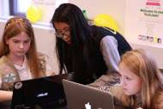 Girl Scouts distil the nuances of programing languages at a TechJam event on Saturday. Photo: Maya Dangerfield