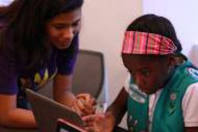 Girl Scouts distil the nuances of programing languages at a TechJam event on Saturday. Photo: Maya Dangerfield