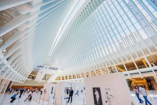 Dozens of retailers, from an Apple Store to a Banana Republic, are at the Oculus, steps from the fallen World Trade Center. Photo: Hillel Steinberg, via flickr