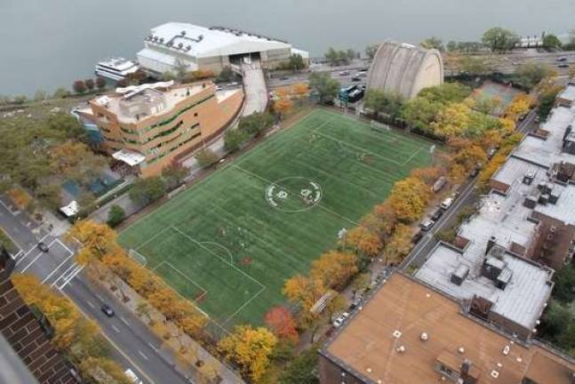 An aerial view of the site of the East 91st Street Marine Transfer Station, which is being constructed next to Asphalt Green's athletic fields.