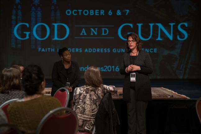 The Rev. Dr. Lisa Thompson, a professor a Union Theological seminary, left, and the Rev. Amy Butler, senior minister at Riverside Church, during a plenary session on gun violence at Riverside Church Oct. 7. Photo: Helena Kincaid