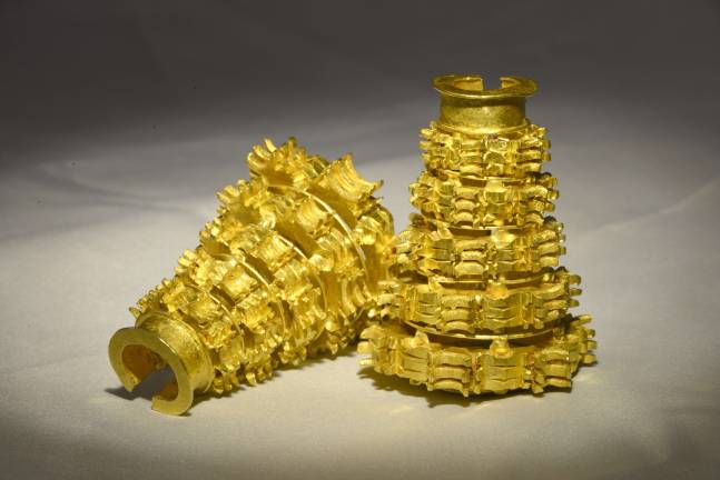 Set of two waist cord weights. Surigao Treasure, Surigao del Sur province, ca. 10th&#x2013;13th century. Gold. Each: H. 2 3/8 in. (6 cm). Bangko Sentral ng Pilipinas, G7P-1981-0003. Photography by Wig Tysmans; Image courtesy of Bangko Sentral ng Pilipinas (Central Bank of the Philippines).