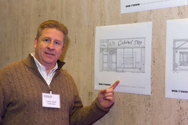 The owner of Little Wolf Cabinets, which was among the companies honored in the neighborhood.