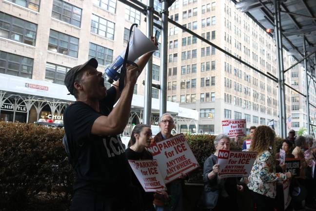 Throughout the hour-long rally, protestor Jay W. Walker, who helped organize Chelsea Neighbors United, yelled chants into a bullhorn.