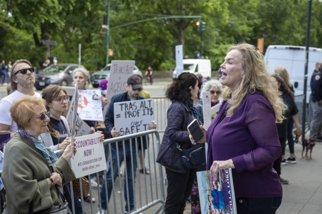 Janet Schroeder, co-founder and director of the NYC E-Vehicle Safety Alliance, speaks to protesters outside Transportation Alternatives’ annual fundraiser.
