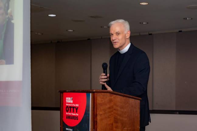 The Rev. John Beddingfield of The Church of the Holy Trinity, accepting on behalf of Honoree Erlinda Brent, who was unable to attend the OTTY event after testing positive for COVID that day. Photo: Steven Strasser