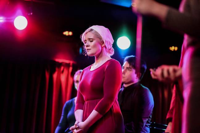 Samantha Stevens onstage in the musical parody of “The Handmaid’s Tale” that she created. Photo: Heather Gershonowitz
