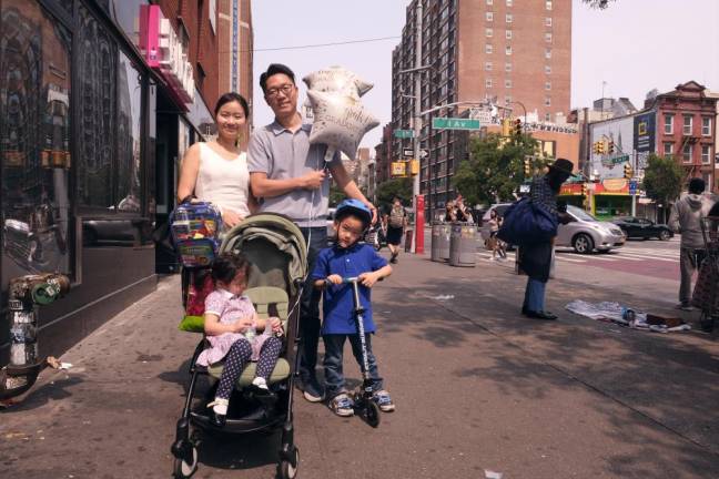 <b>Lana and and Jason Kim said they are moving their kids to PS 40 next year now that Immaculate Conception on E. 14th St. was closing. The school was 159 years old</b>. Photo: Beau Matic