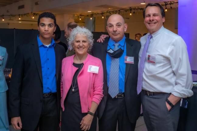 Honoree Craig Trotta (second from right) with his son Craig Trotta, Jr. (left), Jeanne Straus, Rob Byrnes of East Midtown Partnership. Photo: Steven Strasser