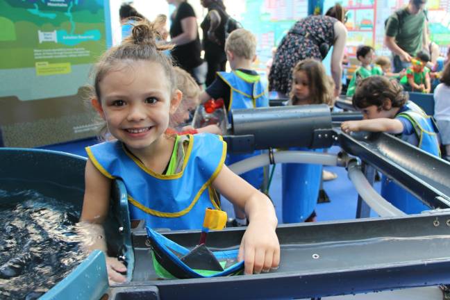 Kids learn about water &#8212; and get up close &#8212; at a summertime exhibit. Photo courtesy of the Children's Museum of Manhattan