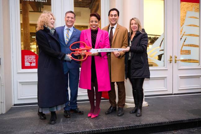 At the ribbon-cutting with a giant scissors labeled South Street Seaport Museum, Feb. 27, 2025.