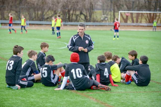 Erwan Saunier sharing wisdom with Manhattan Kicker players