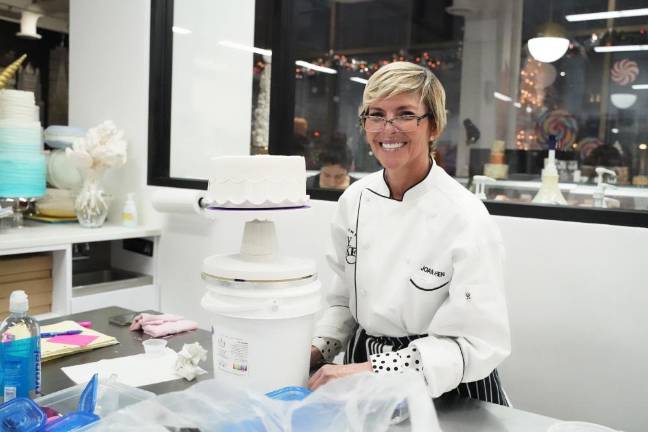 Joan Cohen, who is taking a class in cake decoration at NY Cake, says the shop's holiday display is an incredible opportunity to see great bakers' works.