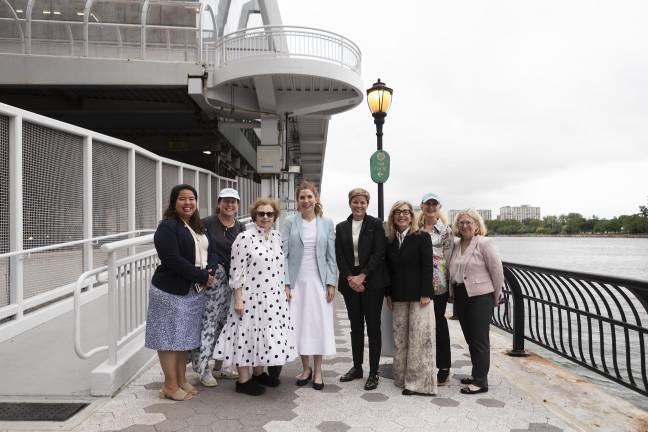 City Council Speaker Julie Menin (pictured center, blue) and NYC Parks Commissioner Tricia Shimamura (pictured far-left) are hailing the partial reopening of the East River Esplanade which will now allow access up to East 73rd Street.
