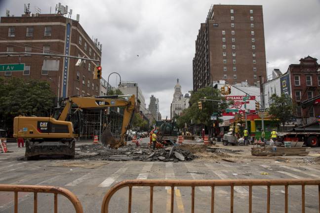 Construction and Con Edison workers were at the scene excavating the roadway two days after the Aug. 3 water main break.