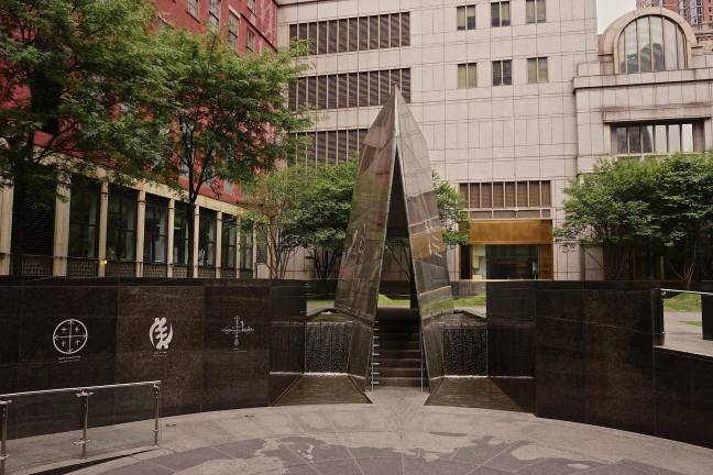 Looking west from Elk Street toward the rear of the Ted Weiss Federal Building at 290 Broadway.