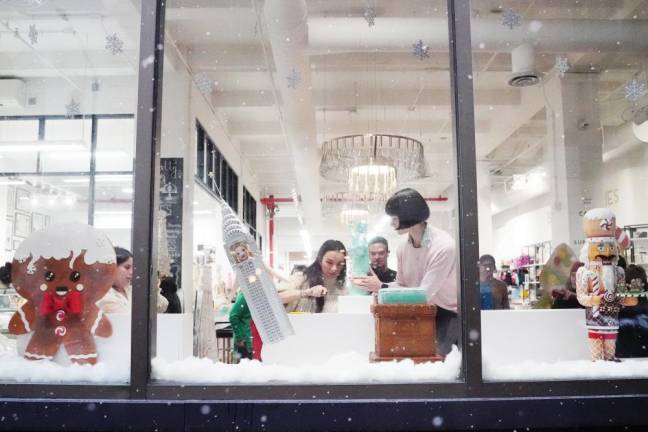 At NY Cake, bakers Marisol Morley and Ashley Holt assemble the chocolate Statue of Liberty. Morley made the cake pedestal and Holt carved the statue.