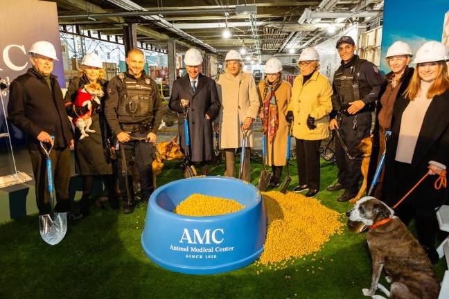 Left to right: AMC Chairman Robert Liberman, Christine Schwarzman, NYPD K9 Rett, Stephen Schwarzman, Elaine Langone, Marianne C. Mebane, Lisa Schiff, NYPD K9 McCue, AMC President &amp; CEO Kathryn Coyne, Megan Hearst. Photo: Ed Lefkowicz
