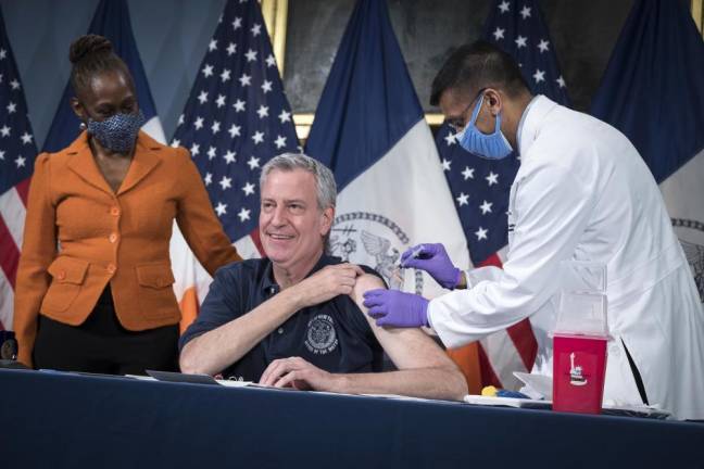 On Thursday, March 18 at City Hall, Mayor Bill de Blasio received a vaccine shot from Health Commissioner Dave A. Chokshi, joined by First Lady Chirlane McCray. Photo: Ed Reed/Mayoral Photography Office