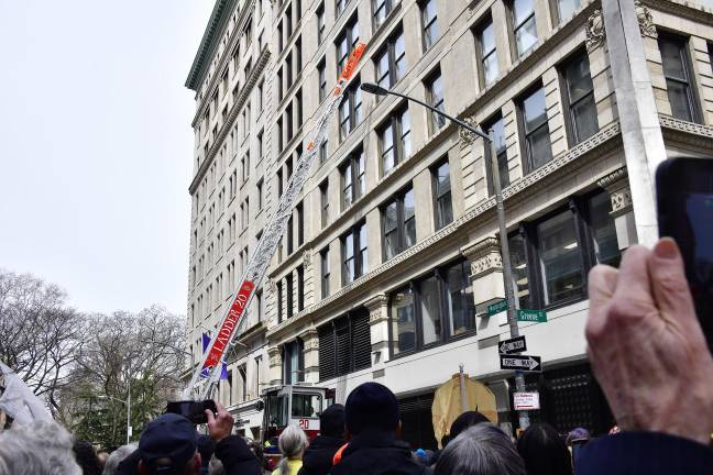 The rising of FDNY Ladder 20 outside the Asch Building, today the Brown Building. The FDNY ladders at the time could only reach the sixth floor.