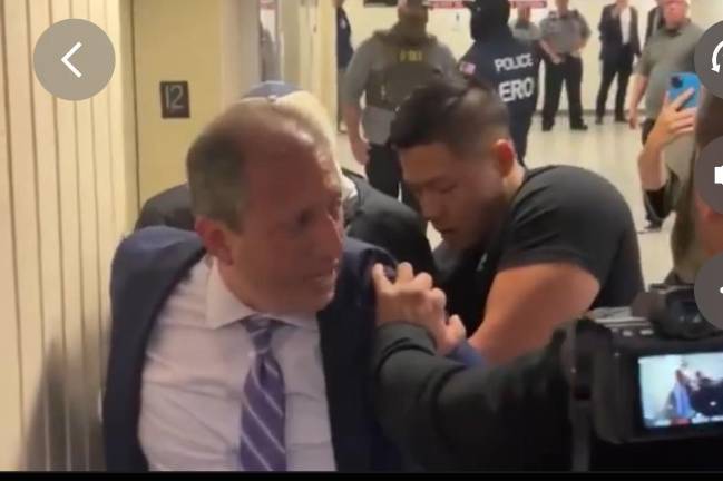 NYC Comptroller as he is handcuffed by ICE agents at 26 Federal Plaza in downtown Manhattan June 17. Homeland security later claimed he was