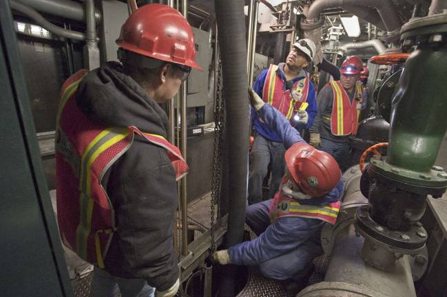 MTA employees used a pump train as they worked around the clock to pumping seawater out of the L train's tunnel following a storm surge in November 2012. Reconstruction of the tunnel, starting in a year, will likely to close the tunnel for the duration, leading to what some fear will be traffic chaos above ground, particularly along 14th Street. Photo: Metropolitan Transportation Authority/Patrick Cashin.