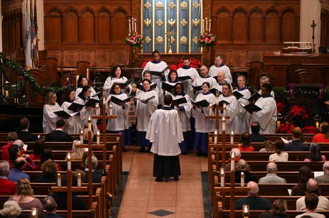 Brick Church Music Director Dr. Raymond Nagem leads the choir in traditional holiday song, including “The Saviour of the World Is Come,” a world premiere composition by Daniel Ficarri.