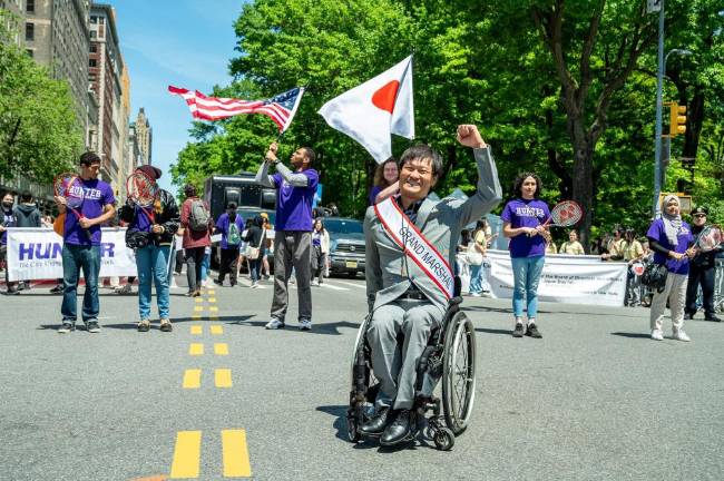 Grand Marhsal Shingo Kunieda leads the parade.