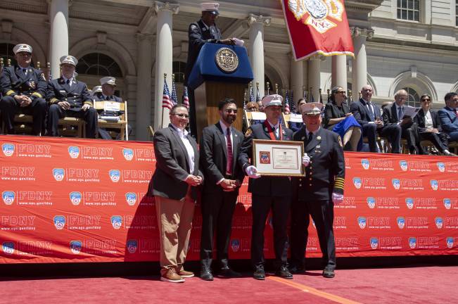 From left to right: Fire Commissioner Lillian Bonsignore, Mayor Zohran Mamdani, Lieutenant James M. Corey, Chief of Department John M. Esposito.