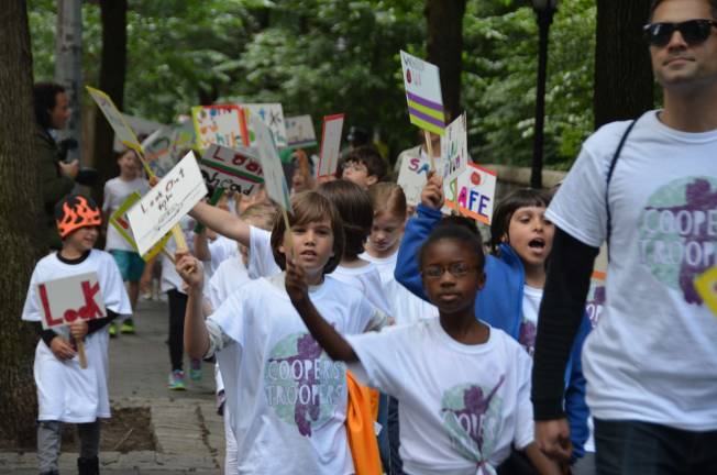 Calhoun School students march in memory of former classmate Cooper Stock, who was killed by a reckless cab driver last January. Photo by Daniel Fitzsimmons.