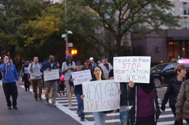 Residents of Holmes Towers and their allies marching from the public housing complex on East 93rd Street to Gracie Mansion to protest the New York City Housing Authority plans for a development at the site of a children's playground. Photo: Daniel Fitzsimmons