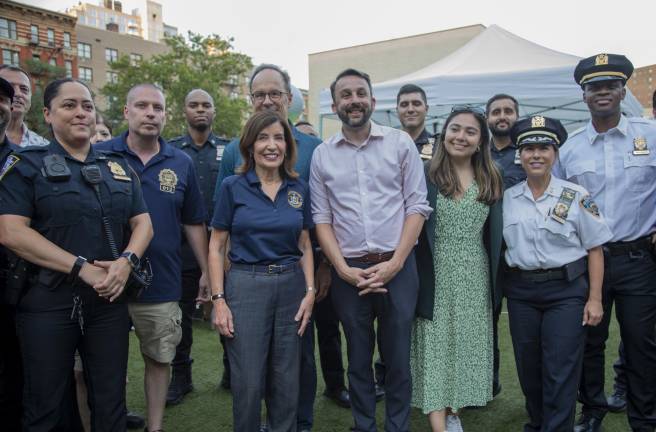 Governor Huchol posing with Assembly Member Keith Powers and police officers on Peter’s Playground, located on Second Avenue and East 20th Street.