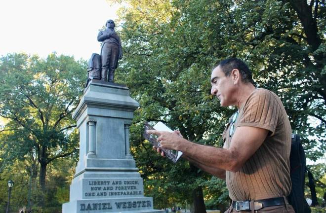 Poet Aaron Poochigian before statue of Daniel Webster in Central Park. The classically trained translator of ancient Greek poetry said his meditative walks through Central Park helped him overcome an addiction to cocaine and eventually led to the publication of his poetic guide book to the Park’s many hidden treasures.