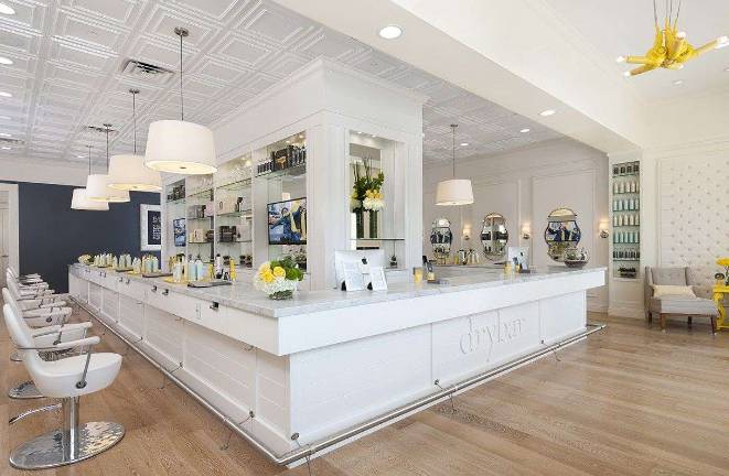 The interior of one of the Drybar locations, where customers can pick the blowout style they want
