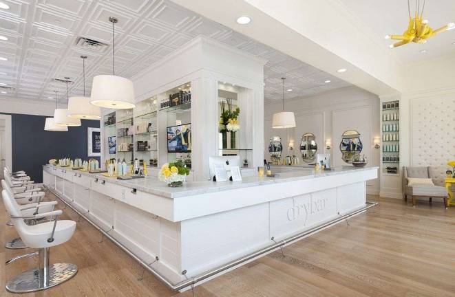 The interior of one of the Drybar locations, where customers can pick the blowout style they want