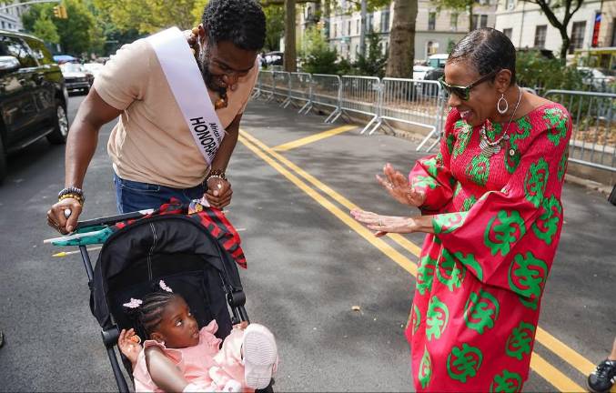 Public Advocate Jumaane Williams (left), his daughter, and Council Speaker Adrienne Adams.