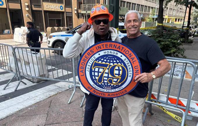 Anthony Williamson (left), business agent and executive board member of the Laborers’ Intenational Union, blasted developer Metro Loft for using non-unionized contractors on the site of the damaged 235 E. 42nd St. building.