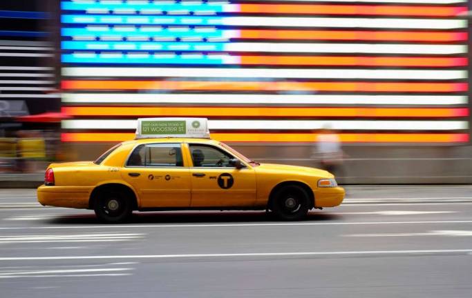 Taxi drivers prefer to drive regular yellow cabs, such as the one pictured, which is among the reasons the disabled and their advocates say wait times are increasing for wheelchair-accessible taxis. Photo: Nick Harris, via Flickr