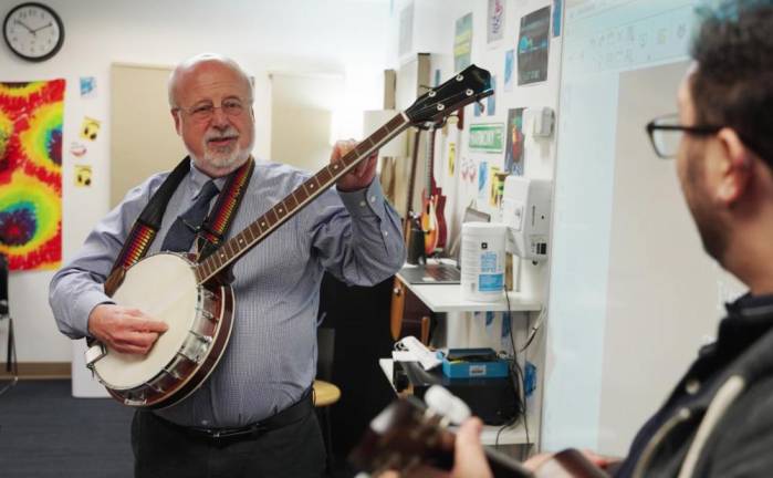 Scott Reisinger, Headmaster of Trevor Day School, strummin’ on the ol’ banjo. Photo: Courtesy Trevor Day School